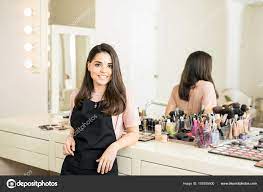 makeup artist in beauty salon stock
