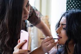 egyptian makeup artist applying lip