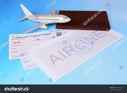 Airline Tickets Passport On Light Blue Stock Photo Edit Now