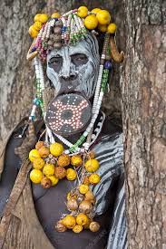 mursi woman with lip plate and body art