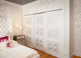 bedroom with white patterned wallpaper