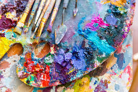 Closeup of art palette with colorful mixed paints and paintbrushed Stock  Photo by vadymvdrobot