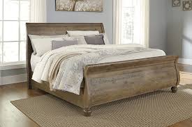 Trishley Light Brown Queen Sleigh Bed