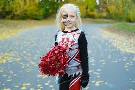 cheerleader costume and halfface makeup