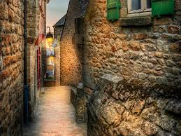 If you try to forget for a moment the souvenir shops, you will feel you are having a walk in a street that comes stra. Mont Saint Michel Village World Heritage Journeys Of Europe