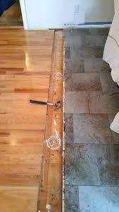 uneven wood and tile flooring