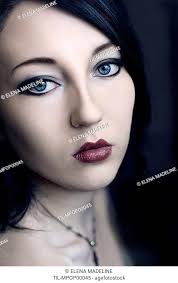 young woman with black hair blue eyes