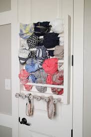 If you're storing scarves for a season (for example putting winter scarves away during summer), you should take extra steps putting them into sealed baggies and in a plastic storage tub will protect them further and keep them looking new. Diy Scarf And Accessory Rack Shanty 2 Chic