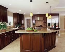 a luxury kitchen with cherry cabinets