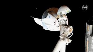 spacex s dragon capsule docks at the