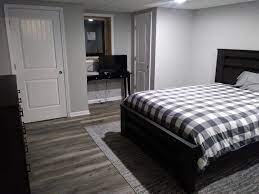 master bedroom with grey laminate flooring