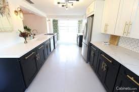 A popular choice for modern kitchens, the black handles (or knobs) provide a great contrast with the bright white of the cabinet. How To Style Your White Shaker Cabinets Cabinets Com