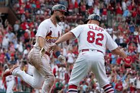 cardinals outslug yankees to complete 3