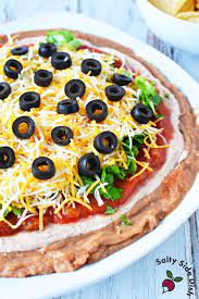 layered taco dip with refried beans