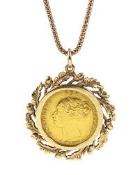 gold pendant on gold necklace chain