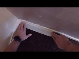 apply masking tape between carpet
