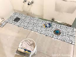 laying floor tiles in a small bathroom