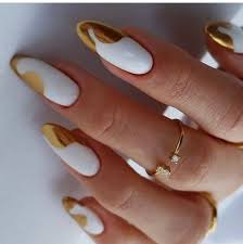 glamorous white and gold accent nails