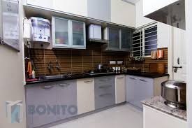 Modern white glossy kitchen cabinets and counter top. 8 Low Cost Kitchen Cabinets Ideas Homify