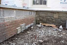 can stone veneer be installed over brick