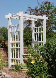 White Garden Arbor In The Garden Arbors