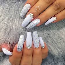 These coffin nails have a light ombre design with lots of rhinestones. True Embellishments For Your Coffin Nails