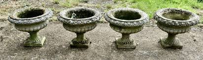 large weathered cast stone garden urns