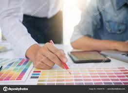 Two Interior Design Or Graphic Designer At Work On Project