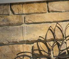 hang art on a stone or brick fireplace