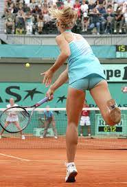 Download Elena Dementieva in action during a tennis match Wallpaper |  Wallpapers.com