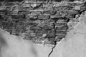 Old Brick Wall With Fallen Off Plaster