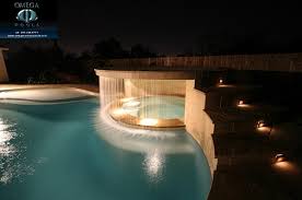 Explore cool cascading water features and landscaping designs. Breathtaking Pool Waterfall Design Ideas