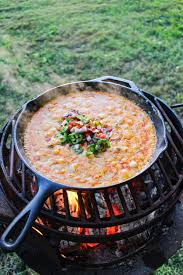 skillet choriqueso over the fire cooking