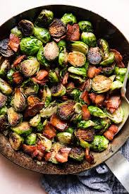 These roasted brussels sprouts with crispy bacon & creamy cheese sauce are perfect for those who are convinced that they don't like brussels sprouts! Maple Bacon Brussels Sprouts The Modern Proper