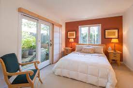 Orange Accent Wall And French Doors