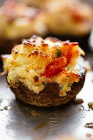 In a large bowl combine crab meat, 1/3 cup panko crumbs, parmesan, mayo, cream cheese, garlic, green onions, herbs, salt and pepper. Crab Stuffed Mushrooms Cafe Delites