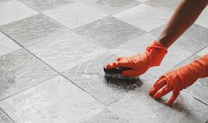 clean grout grime between floor tiles