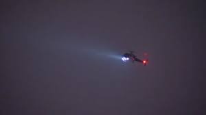 police helicopter flying at night with