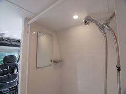 Accordion door, toilet, light, paneling. Building A Wet Bath And Shower Into Promaster Diy Camper Van