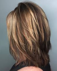 Hair is kept long in the back as the layers surrounding your face gradually draw in towards the back of the head. Medium Length Layered Hair For Women Novocom Top