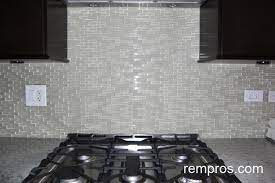 glass mosaic vs marble tiles kitchen