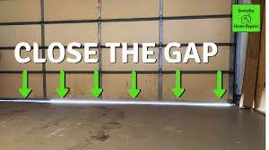 how to fix garage door gap travel