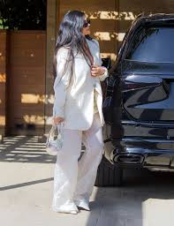 kylie jenner carries gl purse for