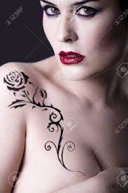 Sensual Beautiful Nude Brunette Girl With Tribal Tattoo Rose Stock Photo,  Picture And Royalty Free Image. Image 17927145.