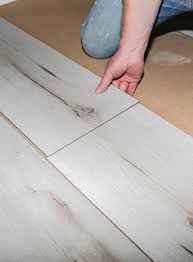 worker making laminate flooring