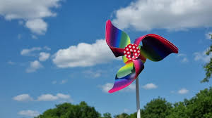 colorful pinwheel toy against the blue
