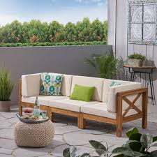 wood outdoor couch with beige cushions