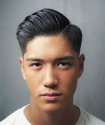 Burst Fade Haircut with a Lot of Volume in the Comb Over