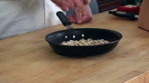 to flip food in a pan sporting chef