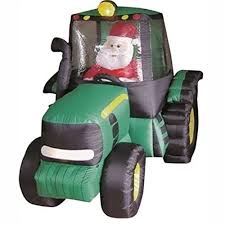 santa in green tractor inflateable